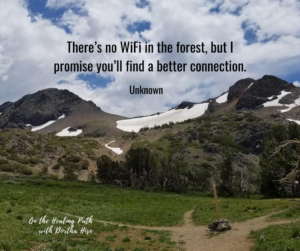 image of a trail and a mountain with quote